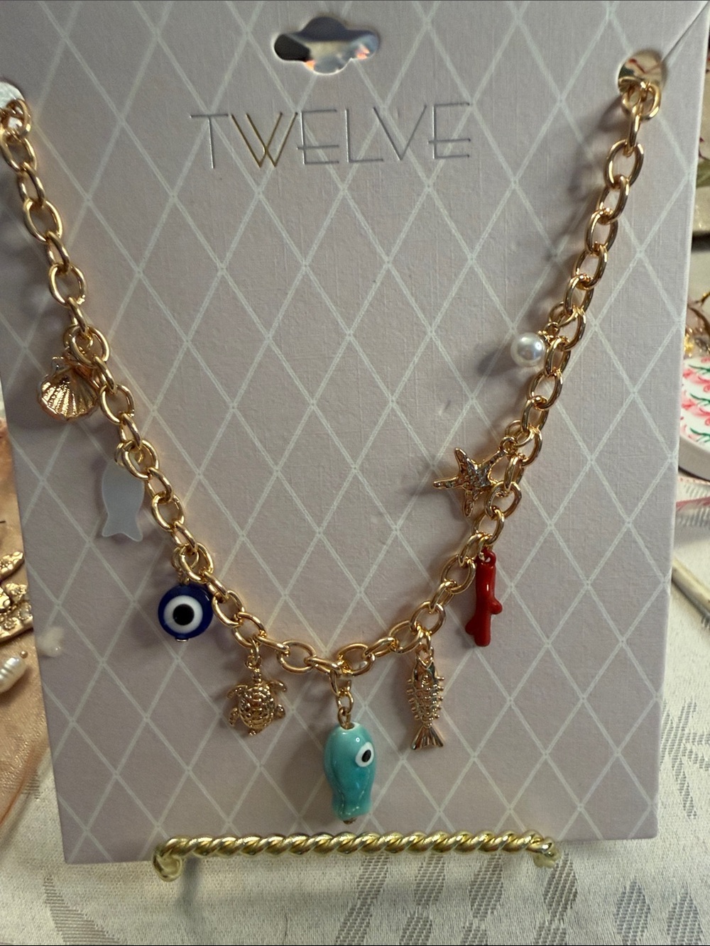 Gold-Tone Charm Necklace with Turquoise Eye and Red Accent